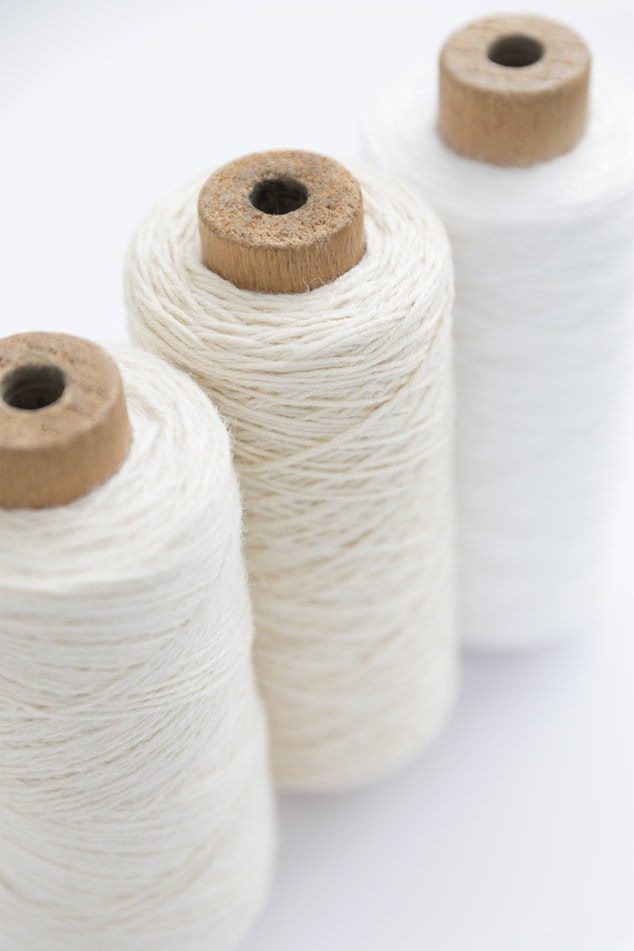 Cones of ivory cotton yarn